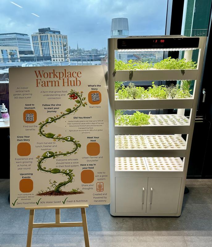 A growing cabinet beside a signage board explaining the growing programme